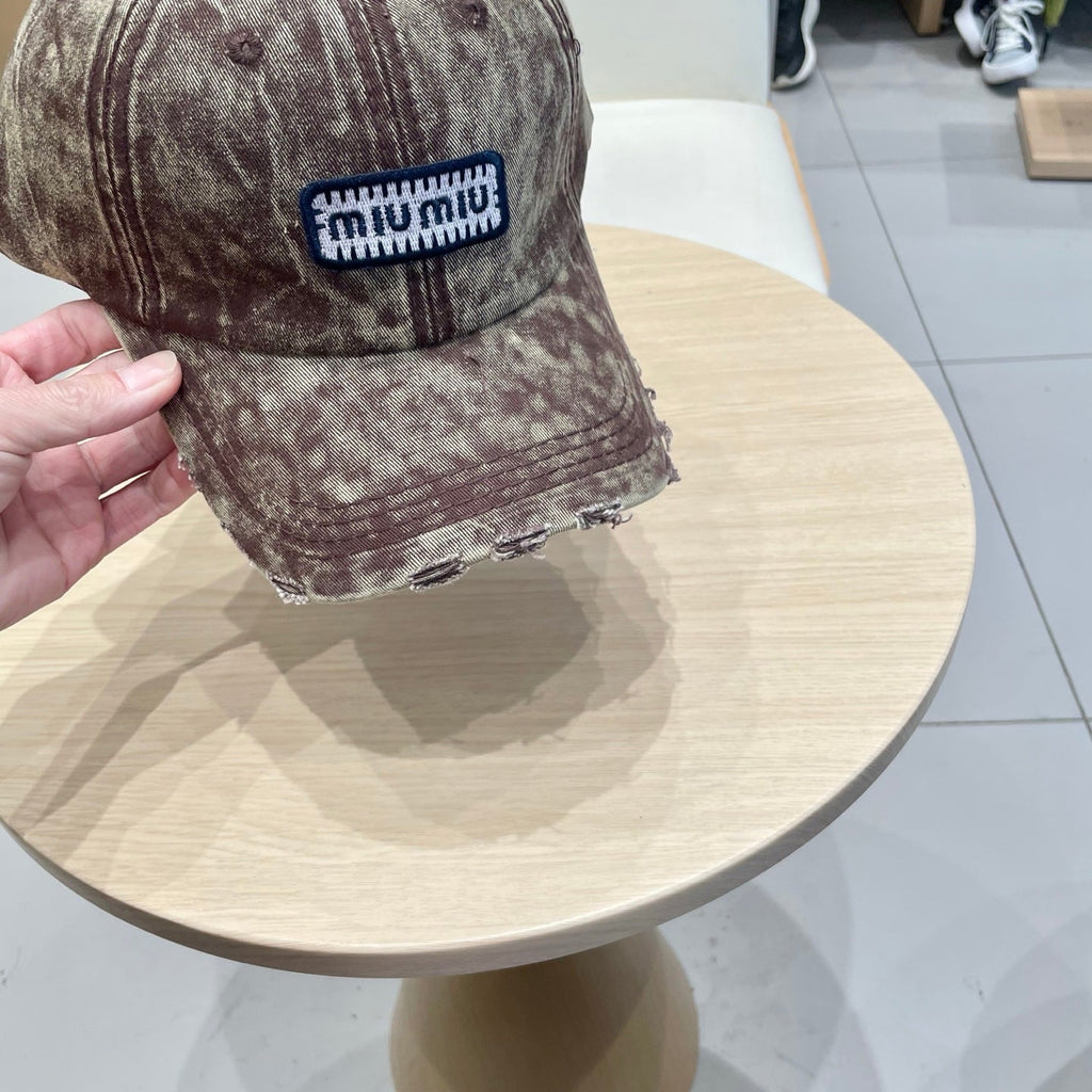 MIU MIU MM DISTRESSED FABRIC BASEBALL CAP IN BROWN WITH EMBROIDERED LOGO