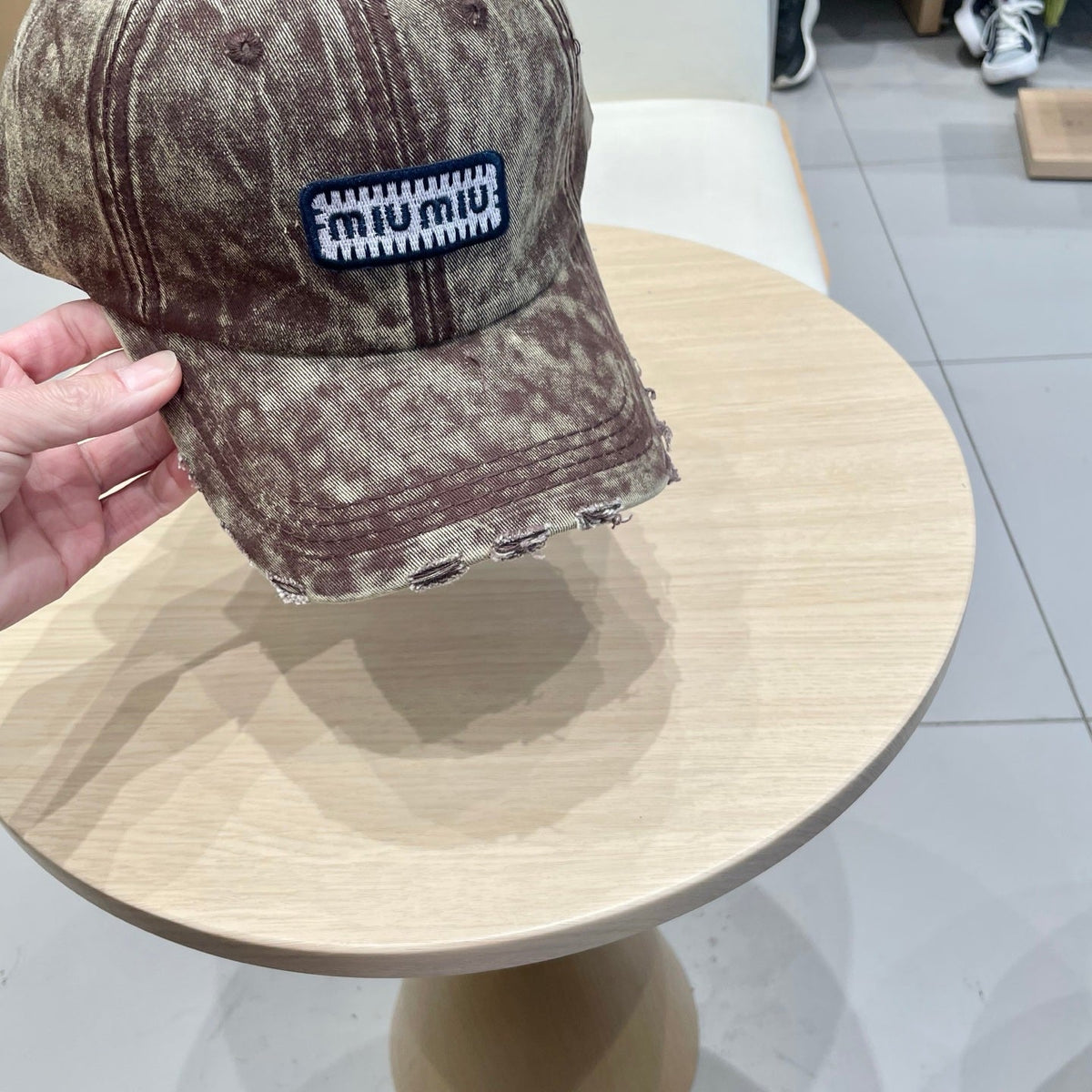 MIU MIU MM DISTRESSED FABRIC BASEBALL CAP IN BROWN WITH EMBROIDERED LOGO